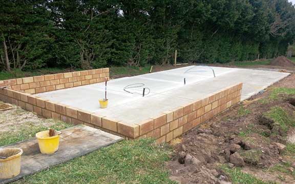 Brickwork and level concrete base by Ker-Way local Woodbridge builder.