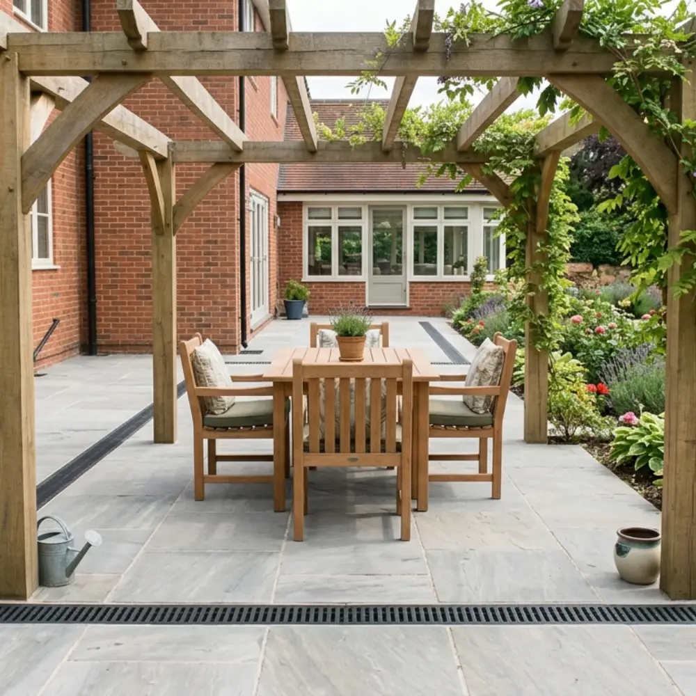 Finished patio area with clean paving and visible drainage channel.